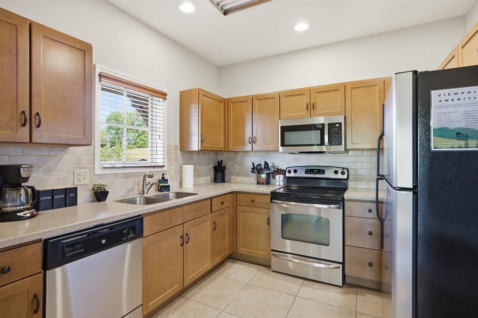Cook, snack, or gather with your group in this fully equipped kitchen, stocked with everything you need and open to the main living space for easy connection.