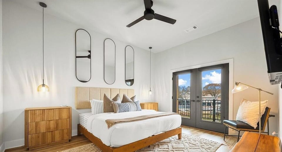 The third king bedroom offers cozy bedding and warm wood accents, creating a welcoming place to rest after a full day.