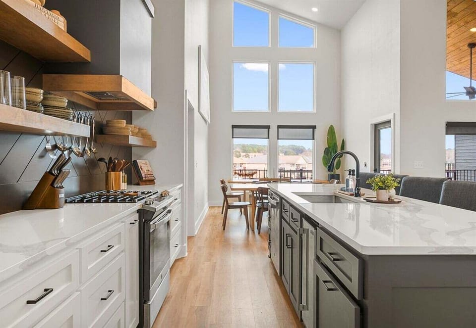 Here's another look at the kitchen's expansive island and modern cabinetry, offering plenty of seating for morning coffee or evening cocktails.