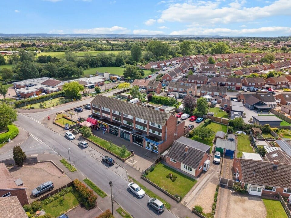 Aerial view of the property and surrounding area, giving you a glimpse of the convenient location and nearby amenities.