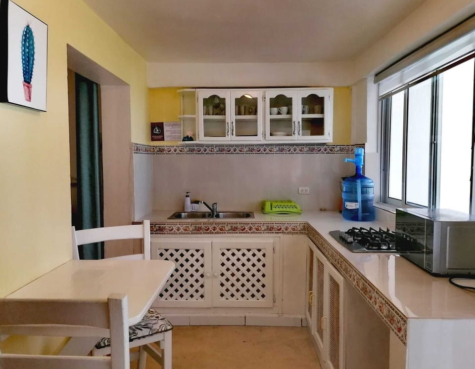 Fridge, microwave, stovetop, cookware/dishes/utensils