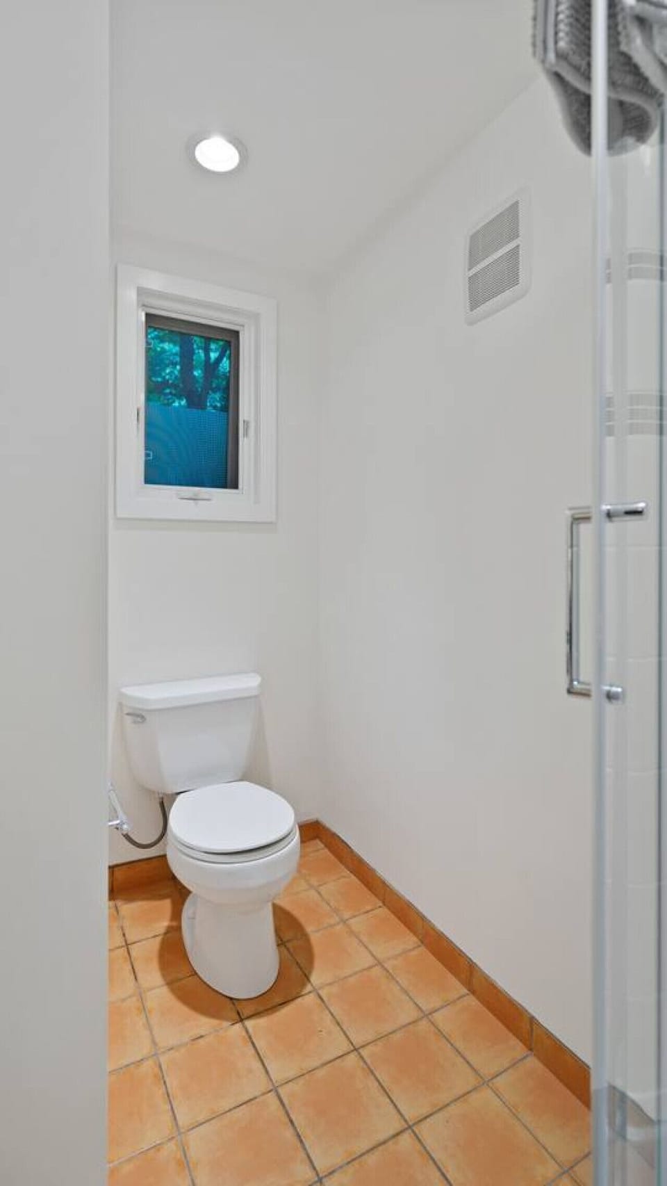 Bathroom Oasis: Enjoy natural light and vibrant tiles for a refreshing escape!