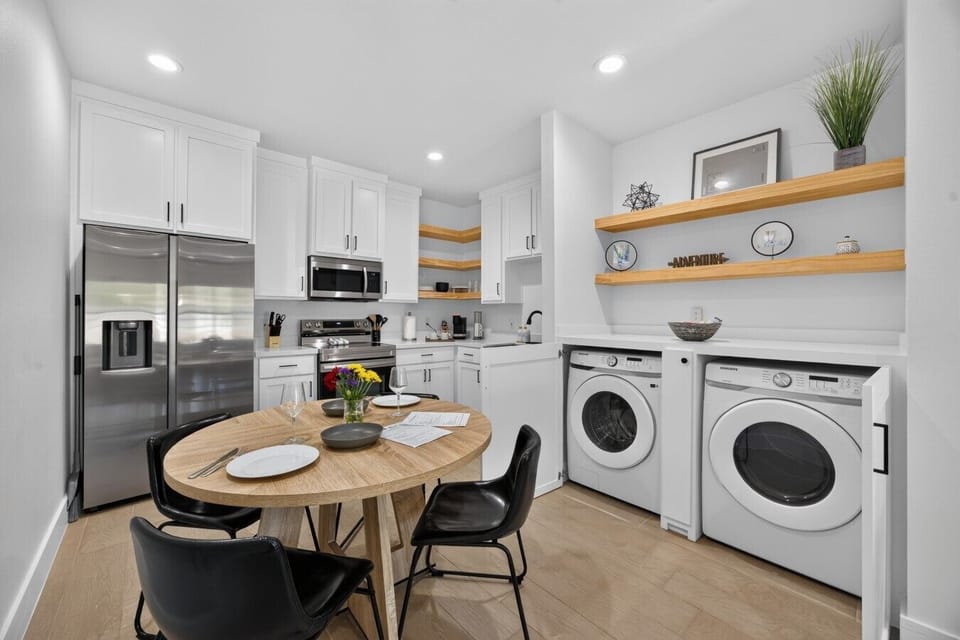 Kitchen | Stainless Steel Appliances & Washer/Dryer | Round Dining Table