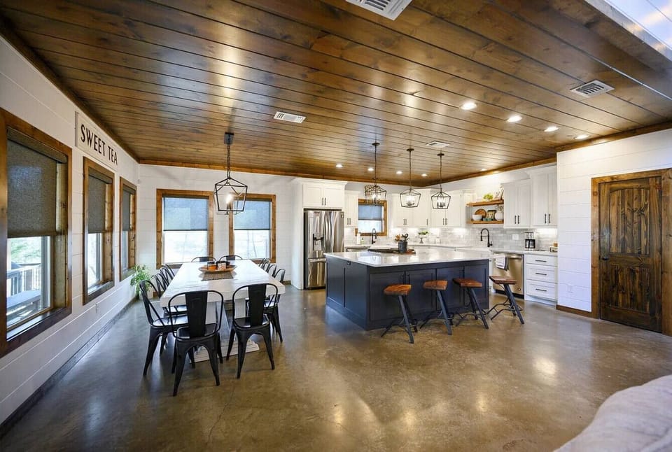 Open concept kitchen & dining area with large island, seating & group-friendly layout