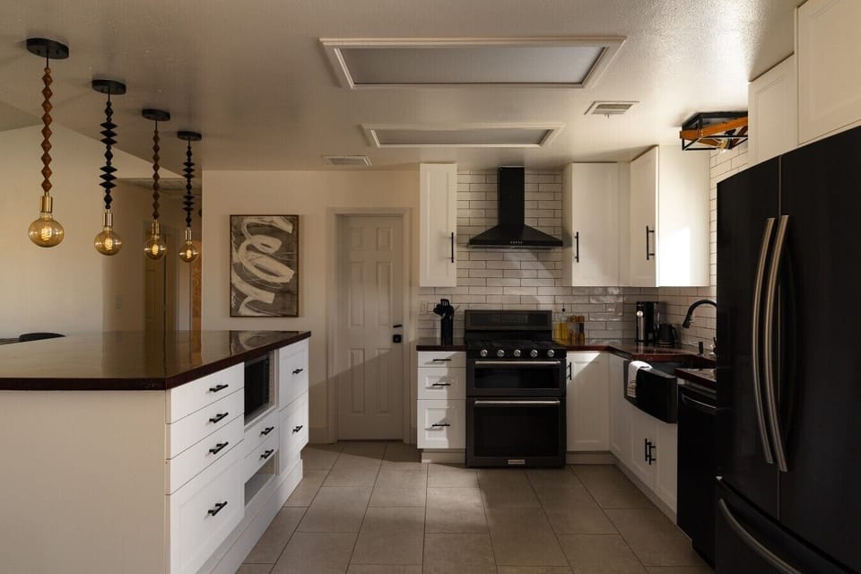 Stretch out on the sofa with the kitchen and dining area.