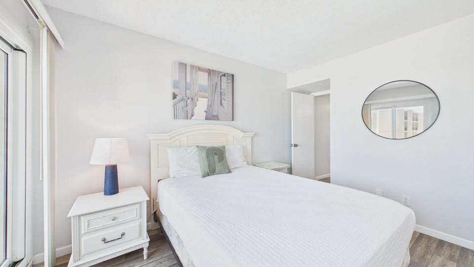 Master bedroom with queen bed and TV + ensuite bathroom (sleeps 2)