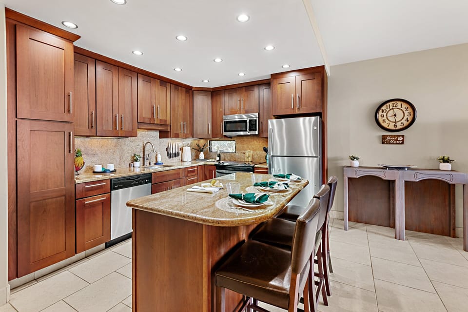 Fully equipped kitchen with granite countertops and bar seating