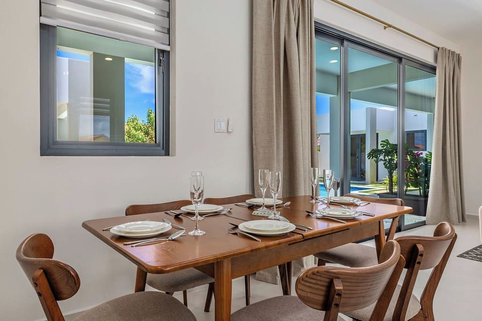 Gather around the dining table for shared meals and meaningful conversations in a warm and welcoming setting