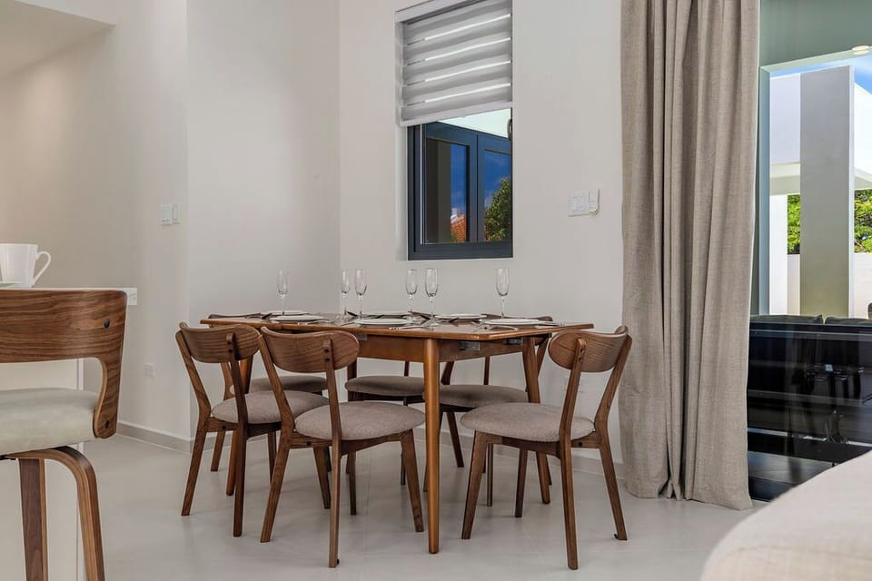 Gather around the dining table for shared meals and meaningful conversations in a warm and welcoming setting