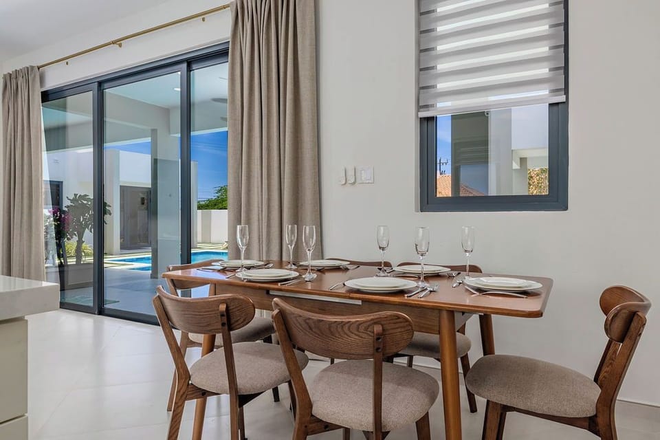 Gather around the dining table and enjoy shared meals in a space designed for connection and comfort