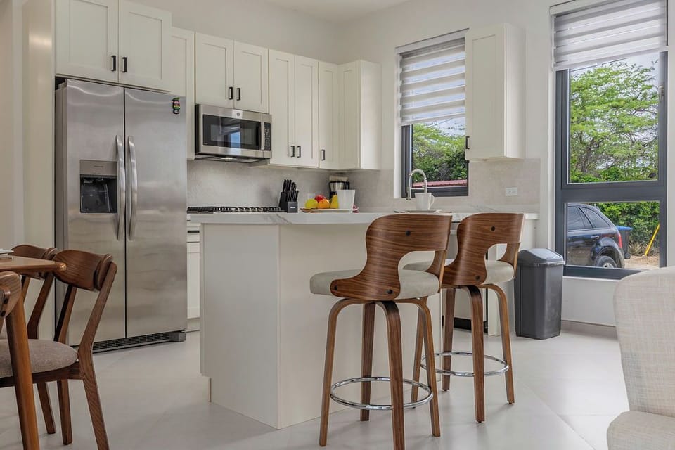 Start your mornings at the kitchen island, perfect for coffee, quick bites, and easy conversation