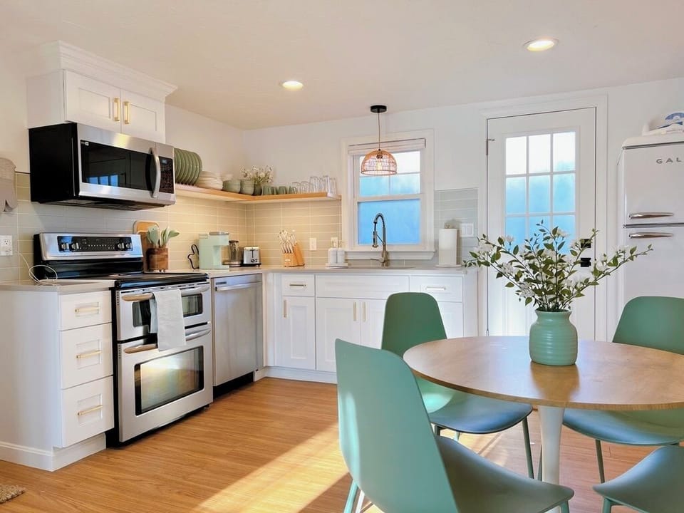 Newly renovated and fully stocked kitchen with eat in dining