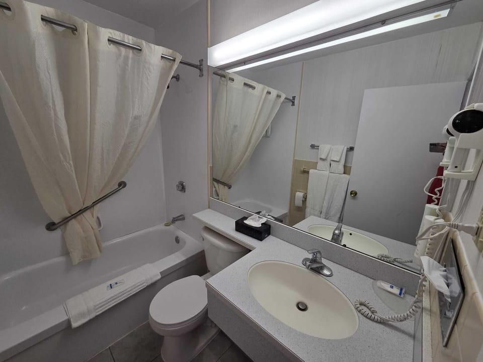 Combined shower/tub, hair dryer, towels, soap