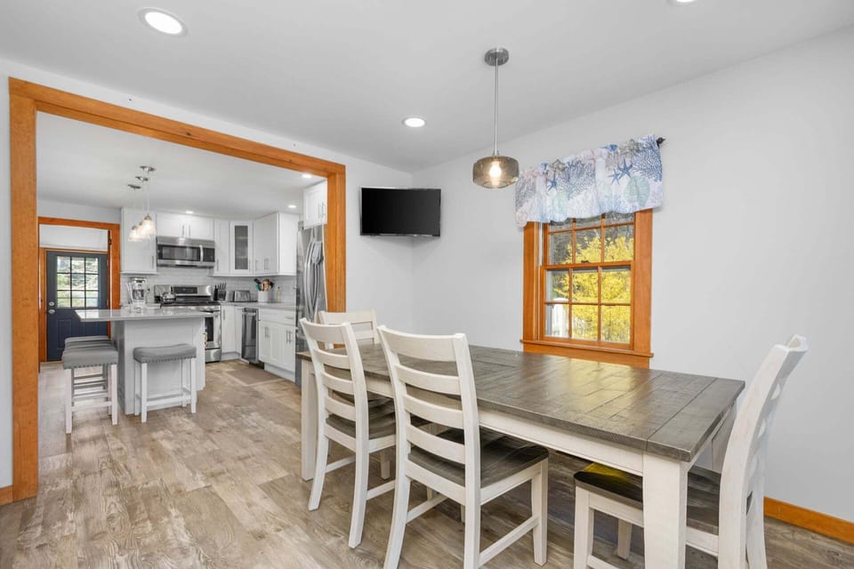 View into the kitchen from the dining area, offering a bright, open flow between spaces