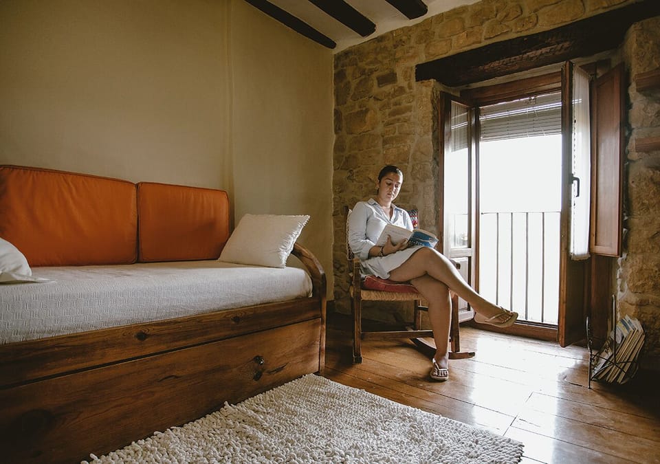 House, 5 Bedrooms | Living area | Flat-screen TV, books