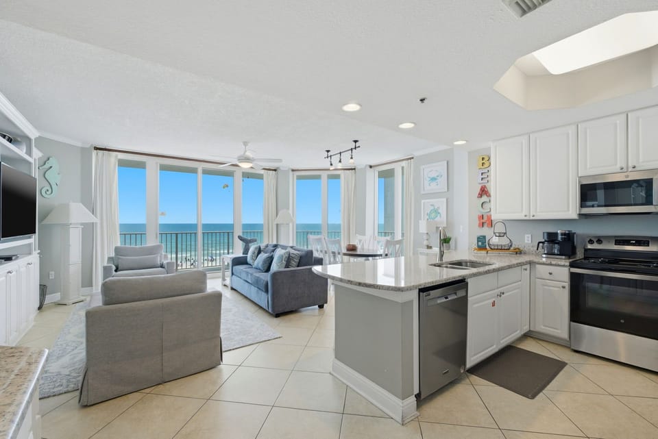 Lighthouse 418- Bright and breezy oceanfront living awaits—picture yourself enjoying morning coffee in this airy, open-concept space where every window frames stunning sea views.