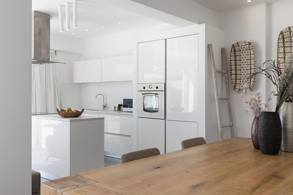 Modern kitchen with all necessary appliances and utensils.