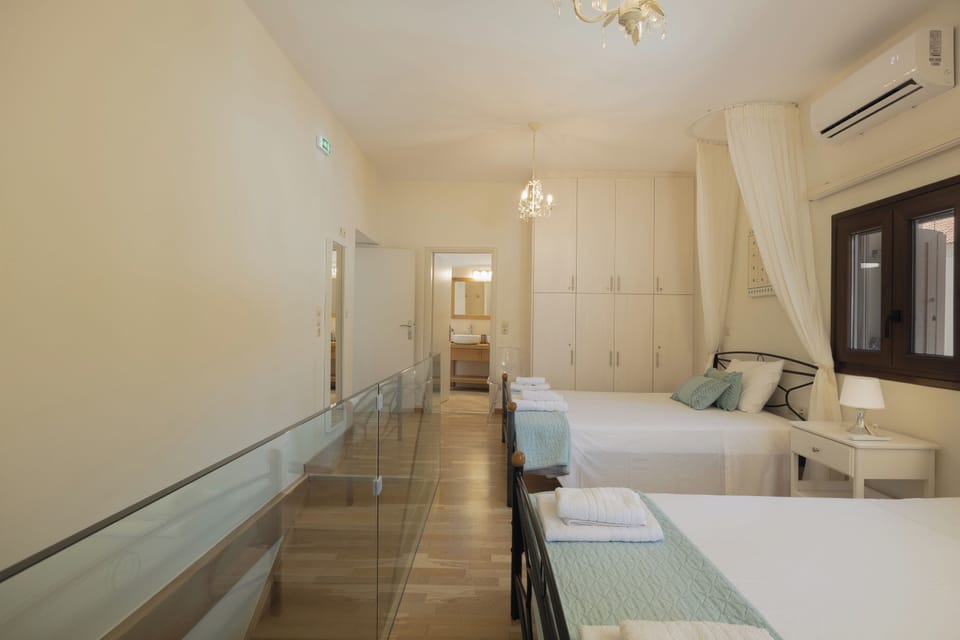 Bright first-floor bedrooms with queen and semi-double beds, sharing a modern bathroom—ideal for families or groups.