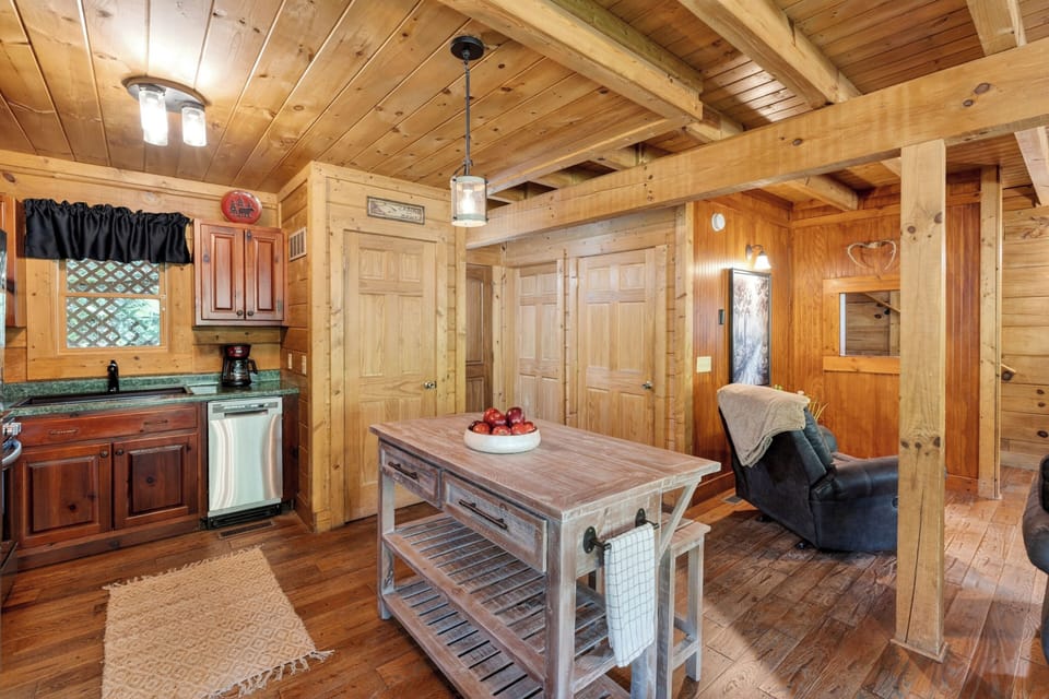 Warm, rustic kitchen with full appliances and island seating.