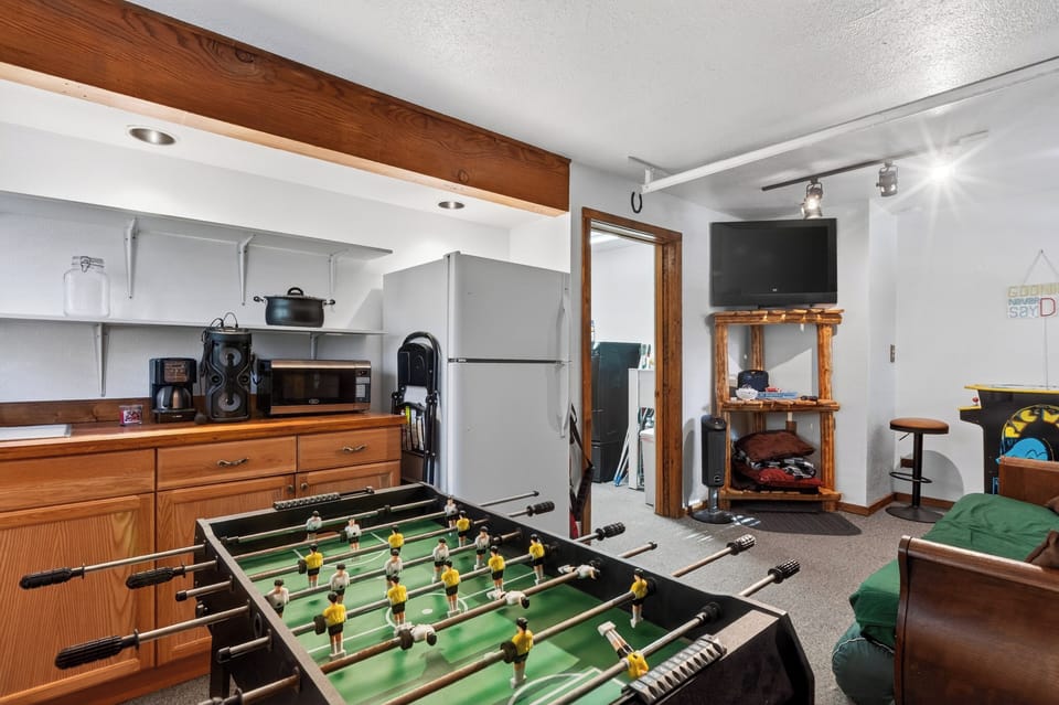 A game room with foosball, arcade fun, and a lounge area adds extra entertainment for the whole group.
