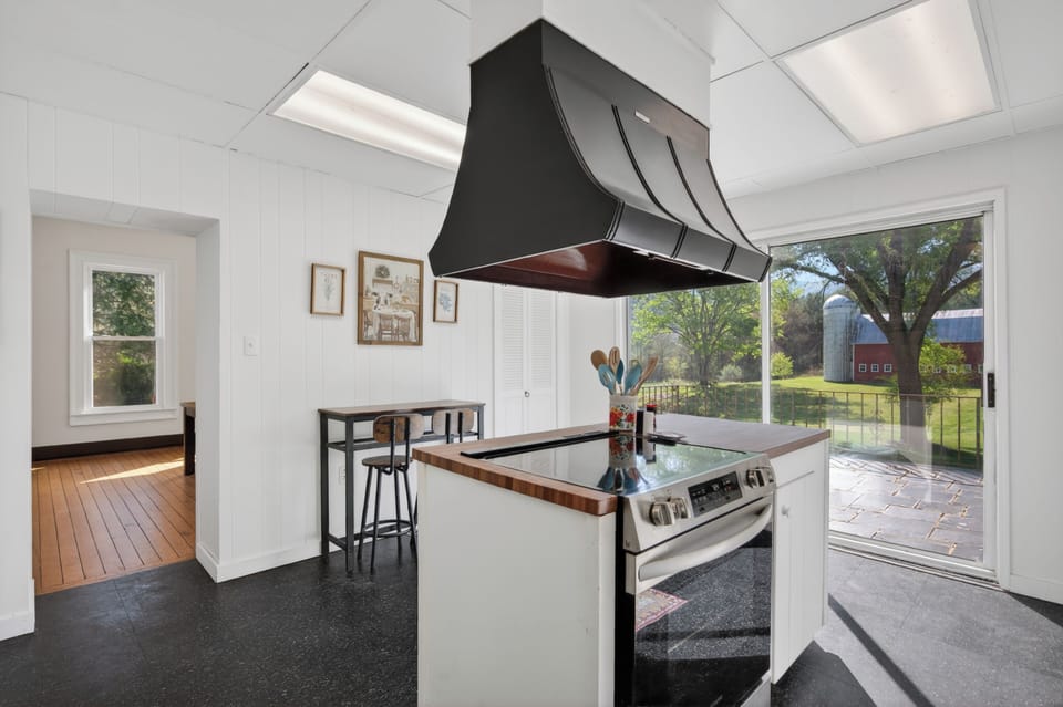 Bright kitchen space with a charming breakfast bar.