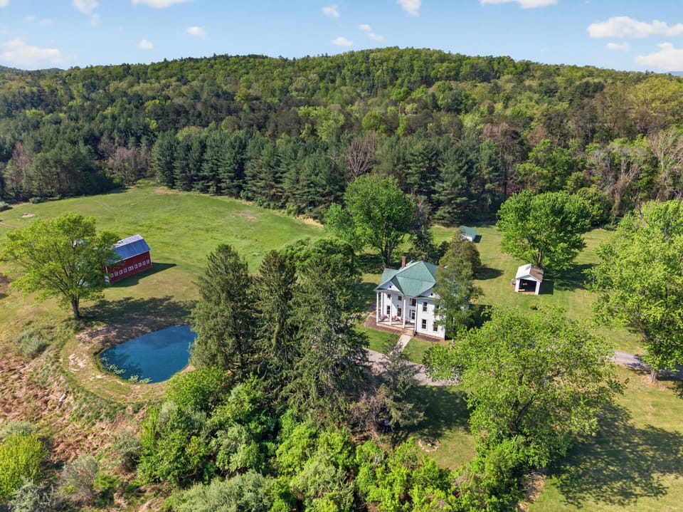 Covered porch views overlooking the peaceful property.