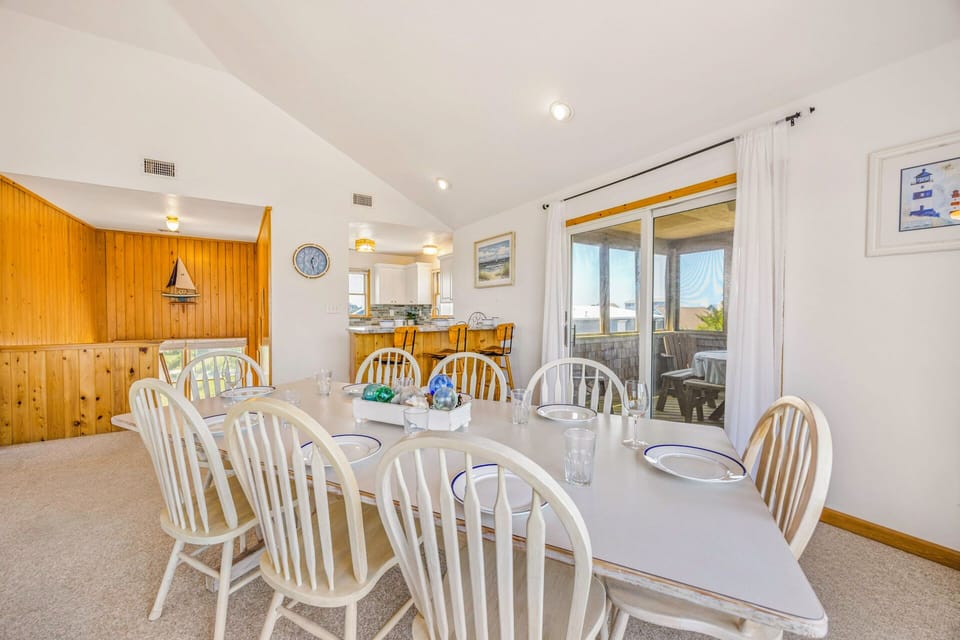 Gather around your spacious dining table for memorable meals with family, featuring seating for ten and beautiful kitchen views.