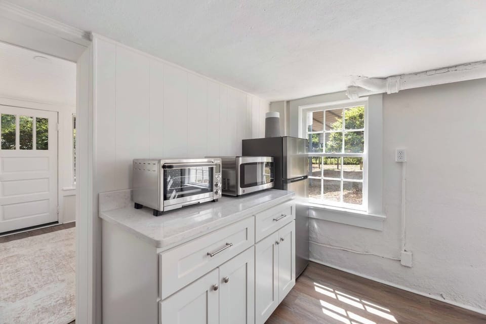 Toaster oven, Microwave, and refrigerator within Kitchenette