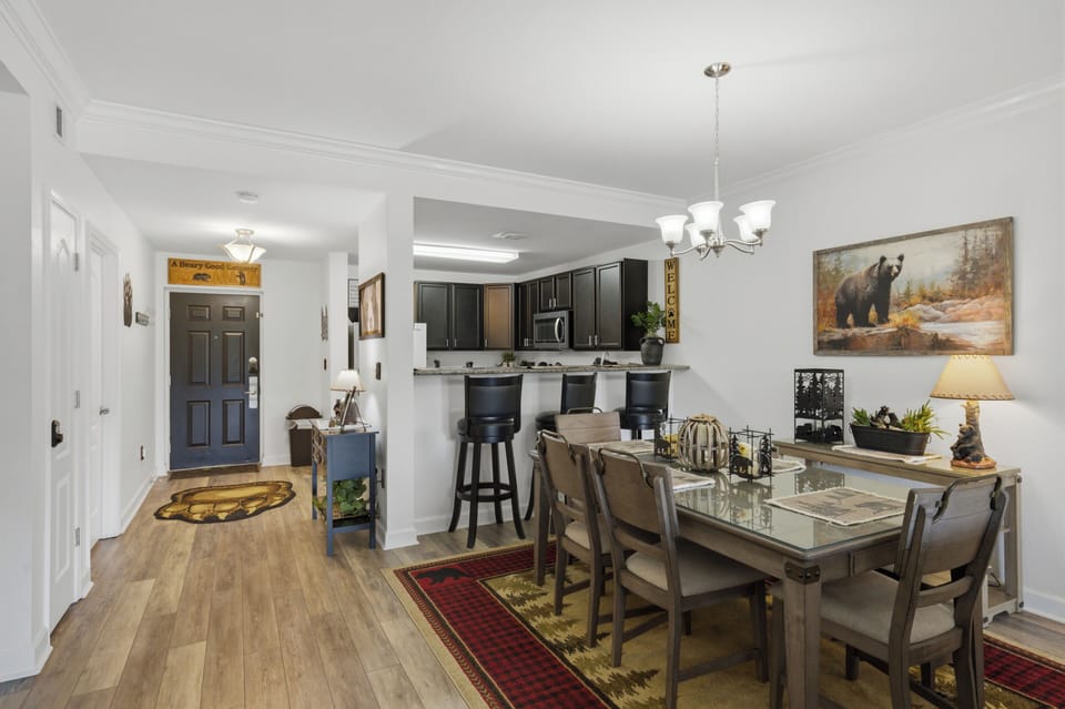 Open dining area with breakfast bar, rustic decor, and welcoming layout