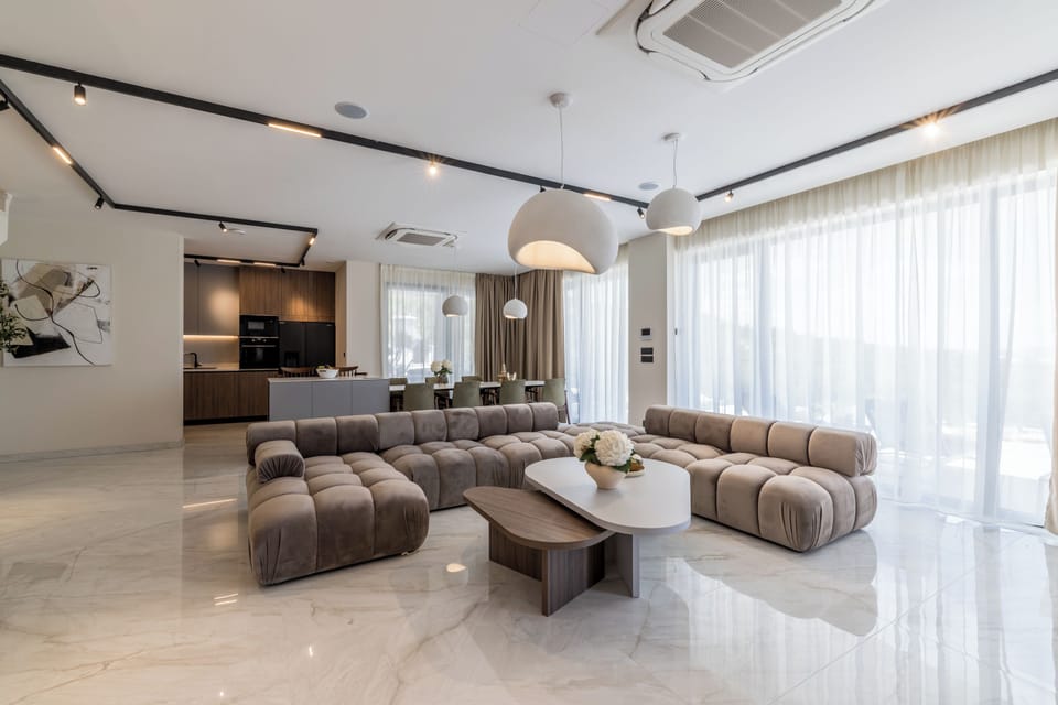Luxury Villa, Balcony, Sea View | Living area | 55-inch flat-screen TV with cable channels, books