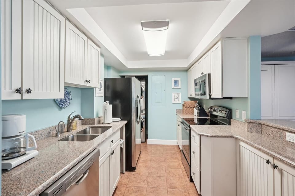 Your fully equipped kitchen features granite countertops, stainless steel appliances, and all the cookware you need to prepare memorable meals during your stay.