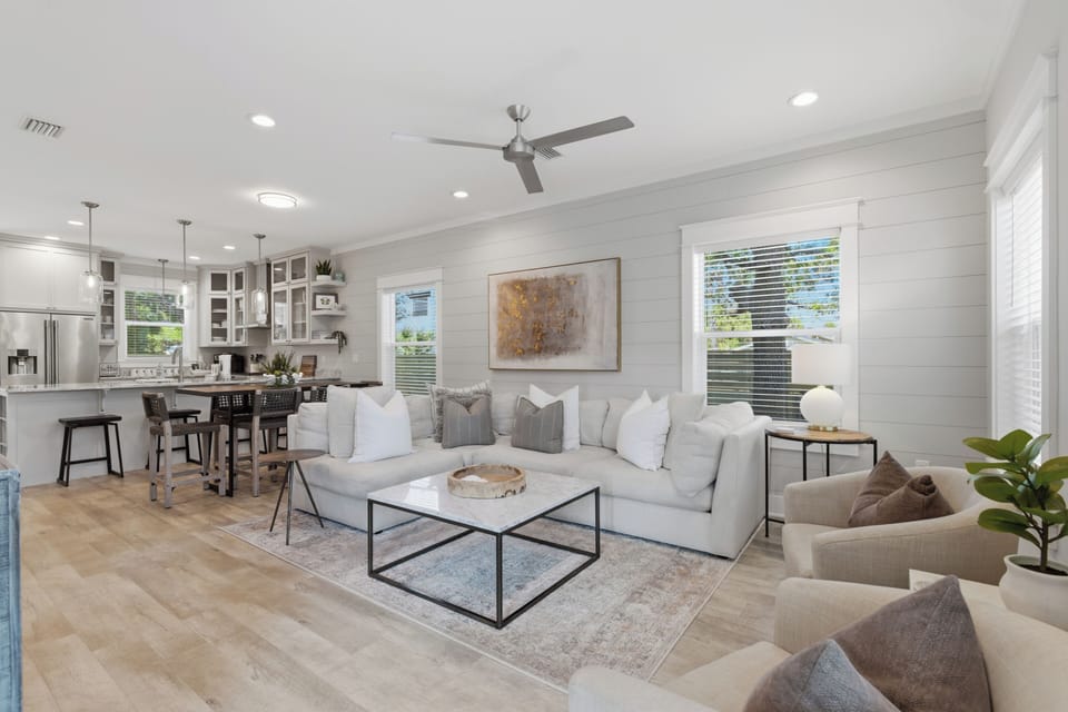 Sink into plush seating in your open-concept living space, where natural light flows through large windows and modern touches create the perfect retreat.