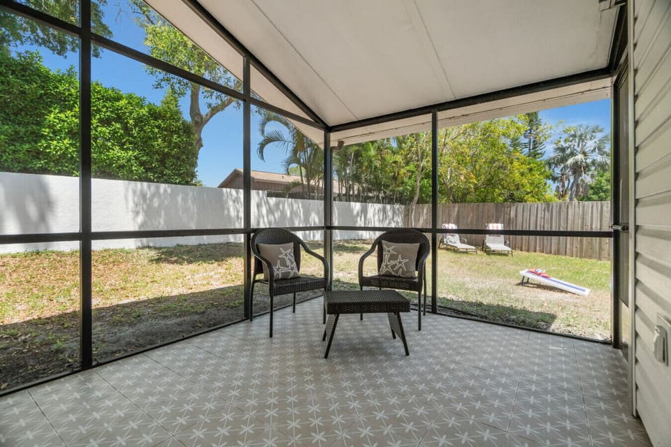Enjoy the outdoors from this screened-in porch just off the third bedroom