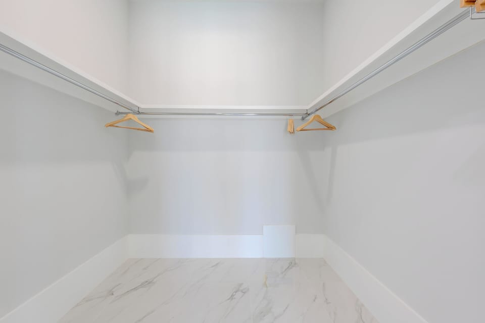 Primary King Bedroom Walk In Closet