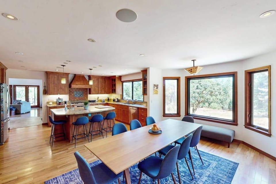 Host a wine country dinner party at the generous dining table for eight — open to the chef's kitchen with built-in ceiling speakers setting your playlist's mood.