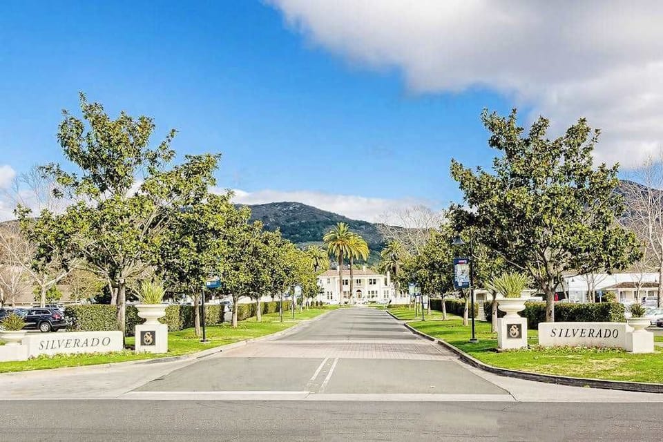 Arrive through Silverado Resort's grand tree-lined entrance with Napa Valley hills as your backdrop — your wine country escape awaits beyond the gates