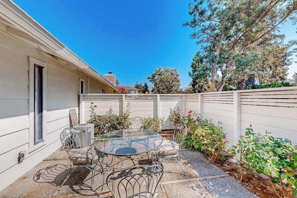 Savor your morning coffee on your private patio with wrought iron bistro seating, blooming roses, and Napa Valley sunshine at your doorstep
