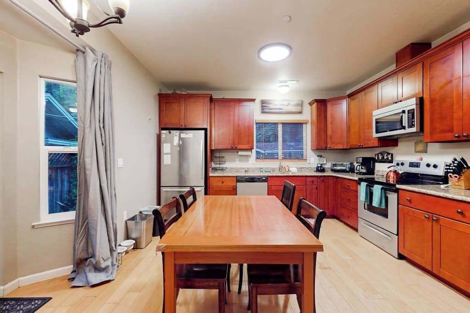 Prepare farm-to-table meals in your fully equipped kitchen featuring rich cherry cabinetry, granite counters, and stainless steel appliances — plus a coffee maker for early mornings.