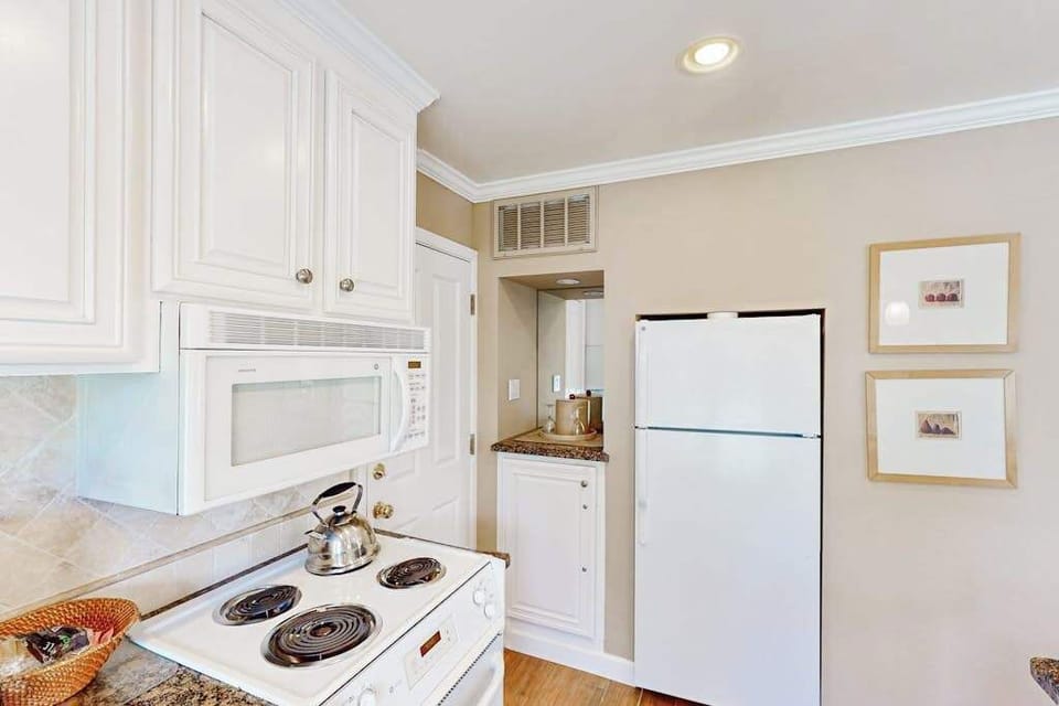 Whip up a quick breakfast with your full kitchen featuring microwave, electric range, and ample cabinet storage before wine tasting