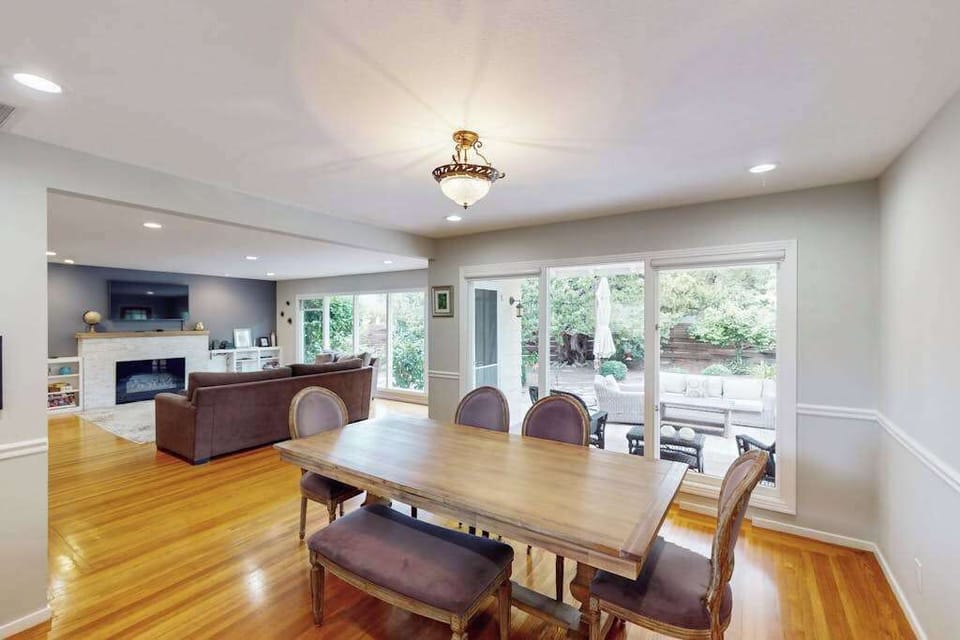 Share farm-to-table meals in your open-plan dining room with garden views through expansive sliding doors — the perfect setting for hosting after a Sonoma Valley wine tour.