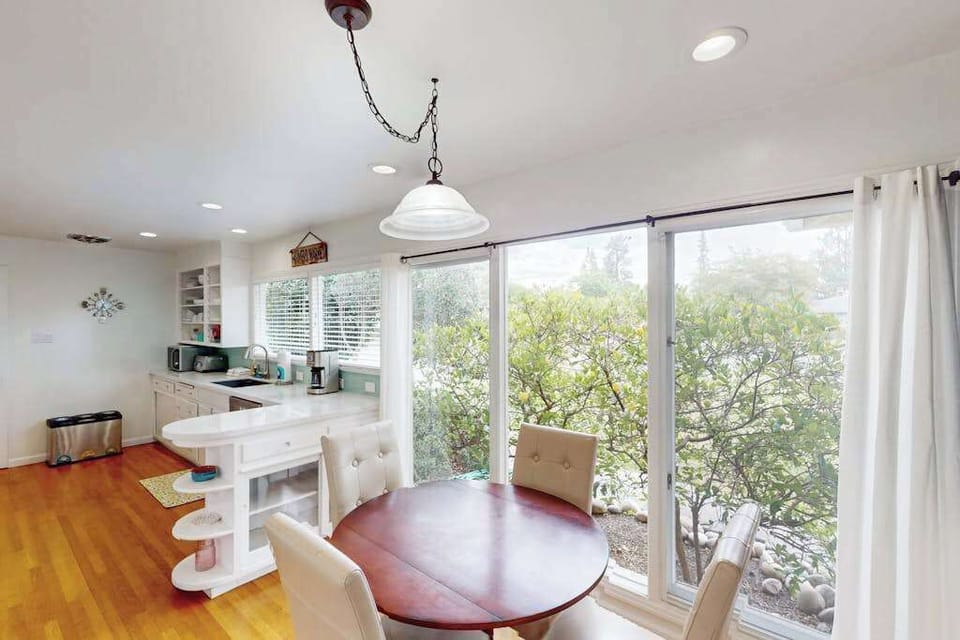 Start your mornings in a sun-drenched breakfast nook with treetop views — floor-to-ceiling glass doors let Sonoma's natural beauty pour in while you plan your vineyard itinerary.