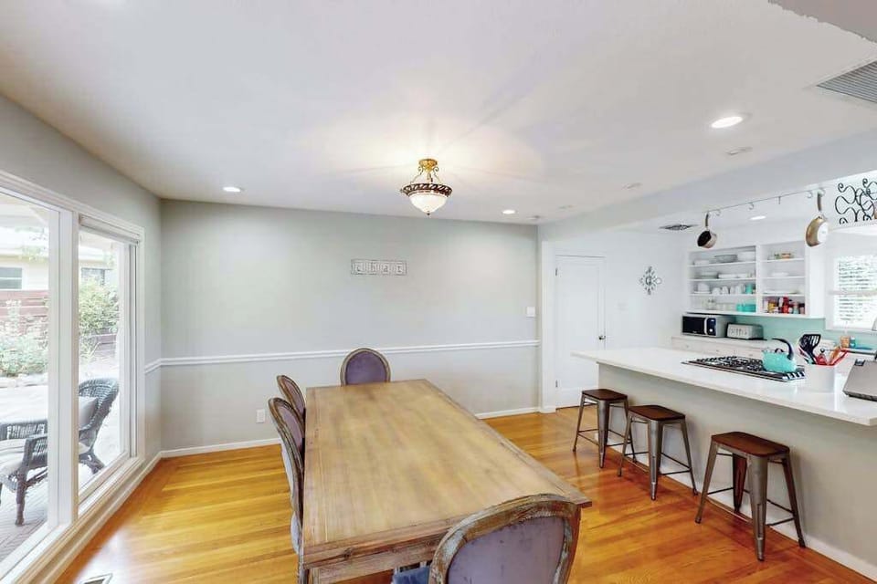Gather around your farmhouse dining table for six and toast to a perfect Sonoma day — bar seating at the kitchen counter keeps the conversation flowing while you cook.