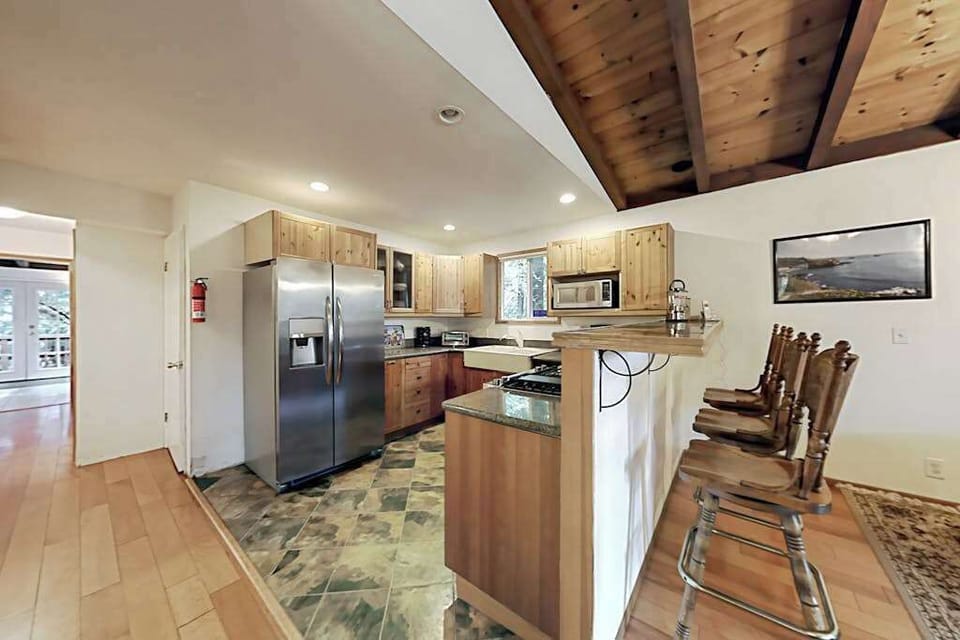 Channel your inner chef in a fully equipped kitchen with stainless appliances and breakfast-bar seating — perfect for prepping farm-to-table Sonoma finds.