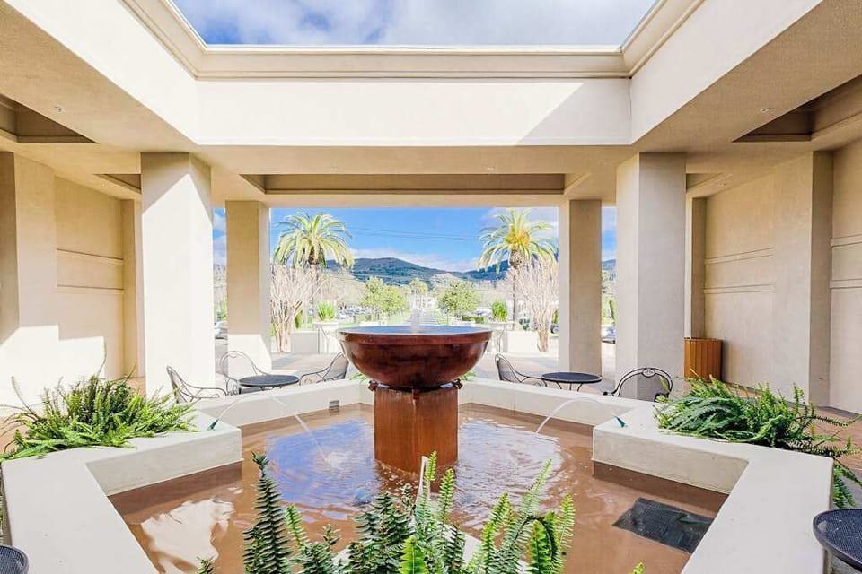Step into the spa atrium where a copper fountain, skylights, and mountain views through open columns invite your deepest Napa Valley relaxation.