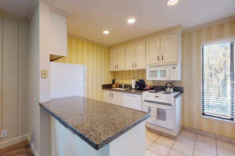 Prepare farm-to-table meals on granite countertops in your fully equipped kitchen with modern appliances and ample cabinet storage
