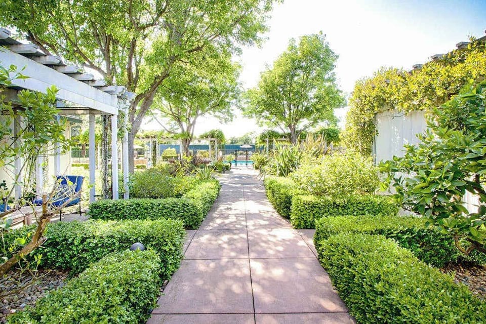 Wander the beautifully manicured garden paths and pergola-shaded walkways throughout your Napa Valley resort grounds
