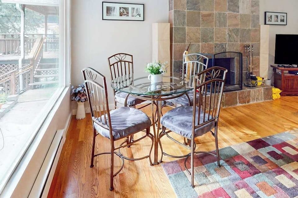 Start your mornings at the sunlit dining table with a peek at the hammock outside — your Guerneville escape blends indoor comfort with redwood forest charm.