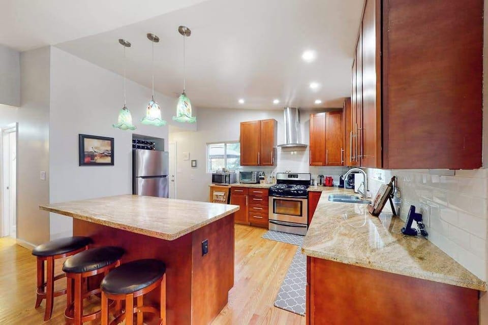 Channel your inner chef in this fully equipped kitchen — granite countertops, cherry cabinetry, and a center island make it easy to prep farm-to-table meals from local Sonoma markets.
