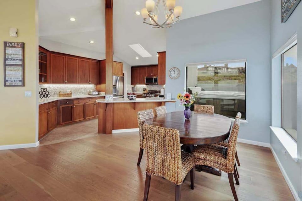 Prepare your catch of the day in a gourmet kitchen featuring rich cherry cabinetry, stainless appliances, and warm hardwood floors.