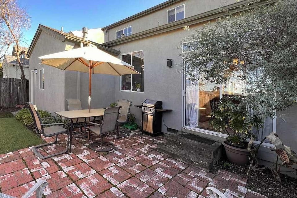 Your private enclosed patio with mature olive tree and brick pavers invites you to grill, dine, and linger over a glass of Sonoma's finest under open skies.